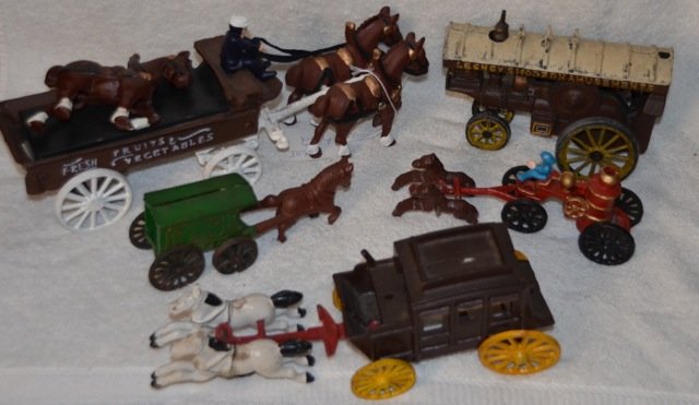 Cast Iron Horse and Buggy Toys: Lot of three horse and buggy toys together with a fire water tanker. Partial pieces as shown in photo. 13-1/2" long; 7-1/2" long; 8-1/2" long