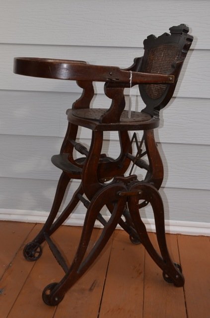 Victorian Eastlake Caned Back High Chair: With gears and wheels. Raises and lowers to specified heights. 37" high