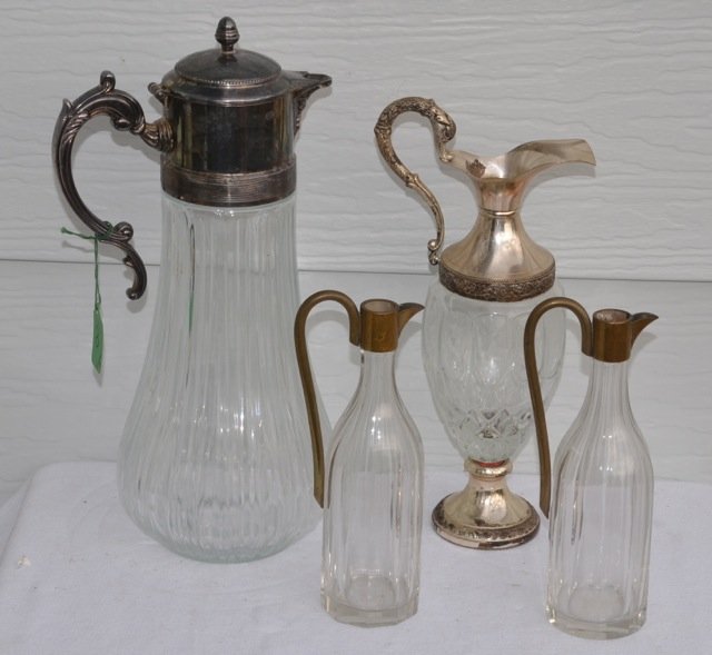 Lot of 4 Glass Ewers: Plated silver handled; brass handled. 14" high to 8-1/2" high