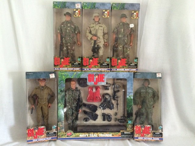Lot of 6 GI Joe Action Figures: Navy Seal Trainee; USAF Korean Pilot; Army National Guard; (2) US Marine Boot Camp; and US Army Desert. In original boxes.