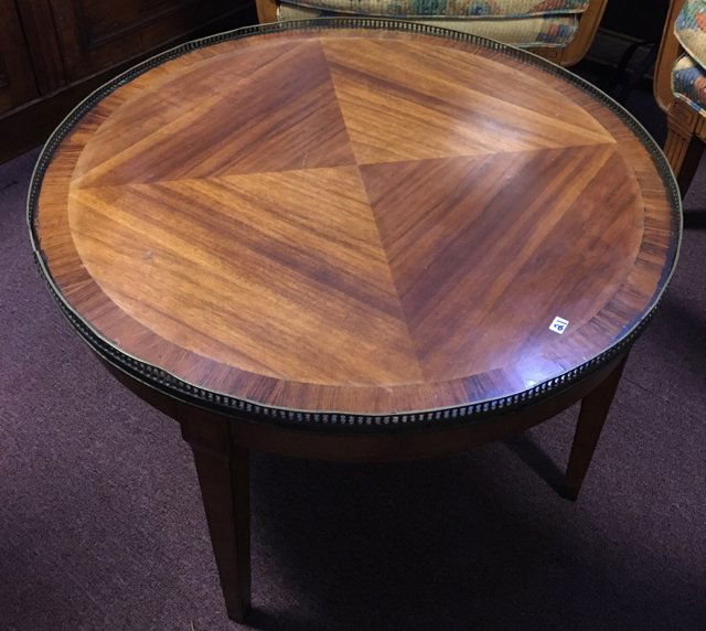 Louis XVI Style Round Coffee Table: Galleried edge. Veneered decorated top. Tapered legs. 18" high x 29" diameter