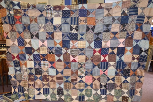 Early 20th C. Quilt Top: Unfinished. Machine stitched, multi colored top, two block pattern styles. Damage at some seams. 68" wide x 86" long