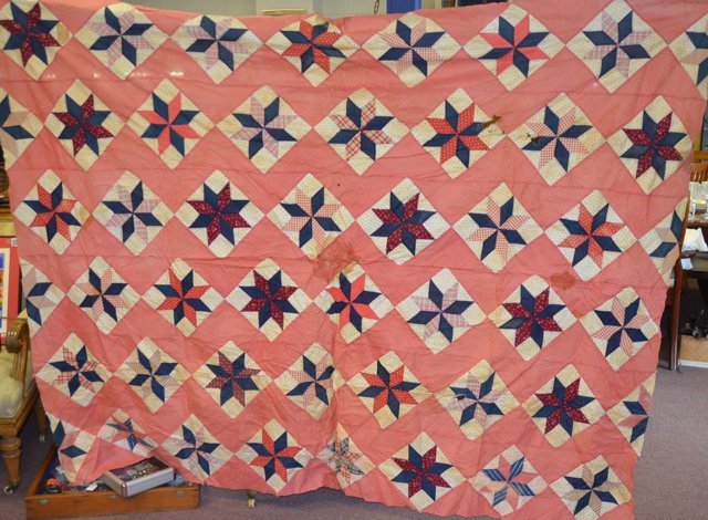 19th C. 8 Pointed Star Quilt Top: Unfinished. Hand stitched. Primarily pinks and blues. With rodent damages and stains. 66" x 86"