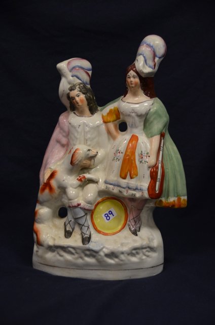 19th C. Staffordshire Scottish Figural Group: Staffordshire Scottish figural group with a dog, two figures, a drum and a fiddle. 10" high
