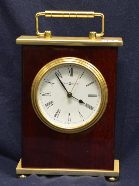 Howard Miller Carriage Clock: Howard Miller Model No.613528. Battery operated. 8" high