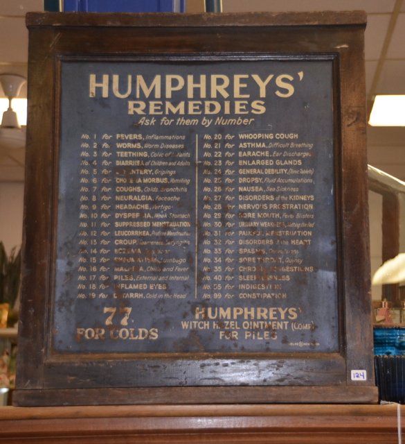 20th C. Humphrey's Remedies Cabinet: Humphrey's Remedies cabinet, the oak case fitted with open boxes in the back. Fair condition. 28" high x 20-1/2" wide x 8-1/2" deep