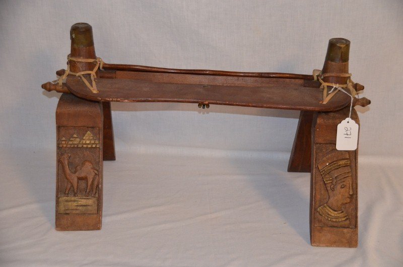 Middle Eastern Camel Seat: Legs are carved with camels, pyramids and a pharoh. Metal medallion on the knob. 27" long x 16" high