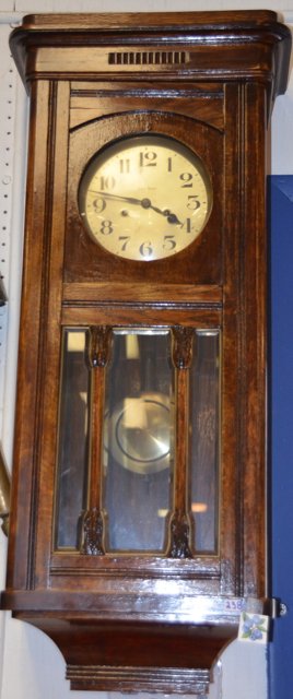 Gustav Becker Oak Cased Wall Clock: Appears to have been refinished and varnished. 34" high x 14" wide x 8" deep