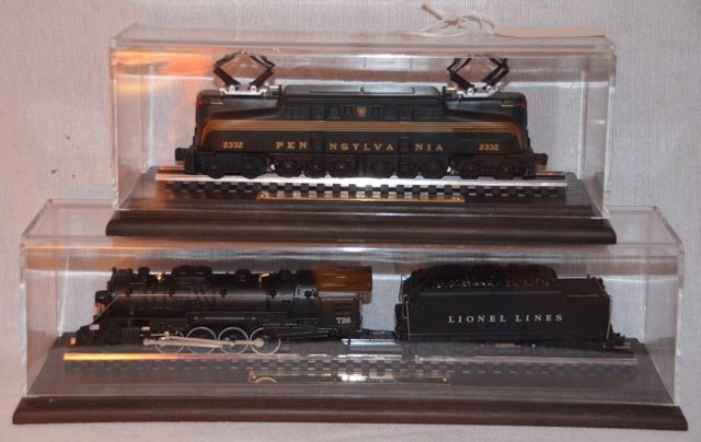 Lionel 20th C. Model Series Trains (2): Two Lionel 20th C. Model Series Trains by Hallmark Lionel 2332 Pennsylvania GG-1; together with a Lionel 726 Berkshire. Both mounted and covered with plexiglass cases. 9" long; and 13-1/2" long