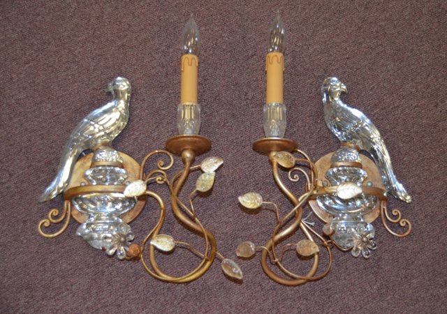Pair of Crystal Banci Italian Bird Sconces: Pair of decorative electric wall sconces mounted with crystal birds on urns and flowering vine, gold tone metal frame. 14" high x 9" wide