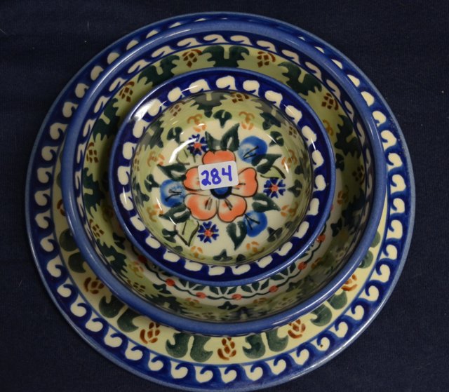 Polish Pottery - Blue & Orange Floral (8): Large handled soup mug; spoon rest; salt & pepper with underplate; bowl; small bowl; and a trivet. 4" high; 5-1/4" long; 2-1/2" high & 5-1/4" long; 5-3/4" dia; 4" dia; 7-1/2" diameter