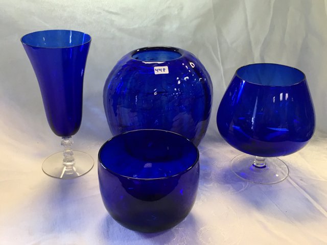 Cobalt Blue Glass Lot (4): A bowl, footed vase, vase, and a footed cup. 3-3/4" high; 6" high; 6-1/2" high; 7-3/4" high