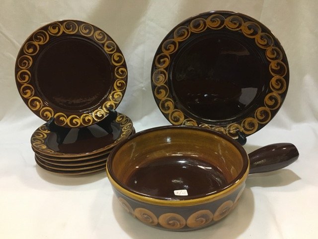 Brown Stoneware Service: A casserole, six (6) plates and a round serving plate. Marked with an "F."
