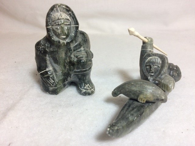 Two Soapsone Inuit Eskimo Figures: Caved soapstone figures. 3" high and 5-3/4" long