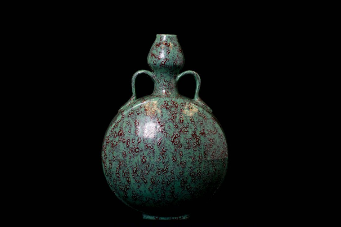A green glazed vessel: A rare green glazed vessel with red accents Chinese Moon Flask, Qianlong Mark on base. H 12in. (31cm)