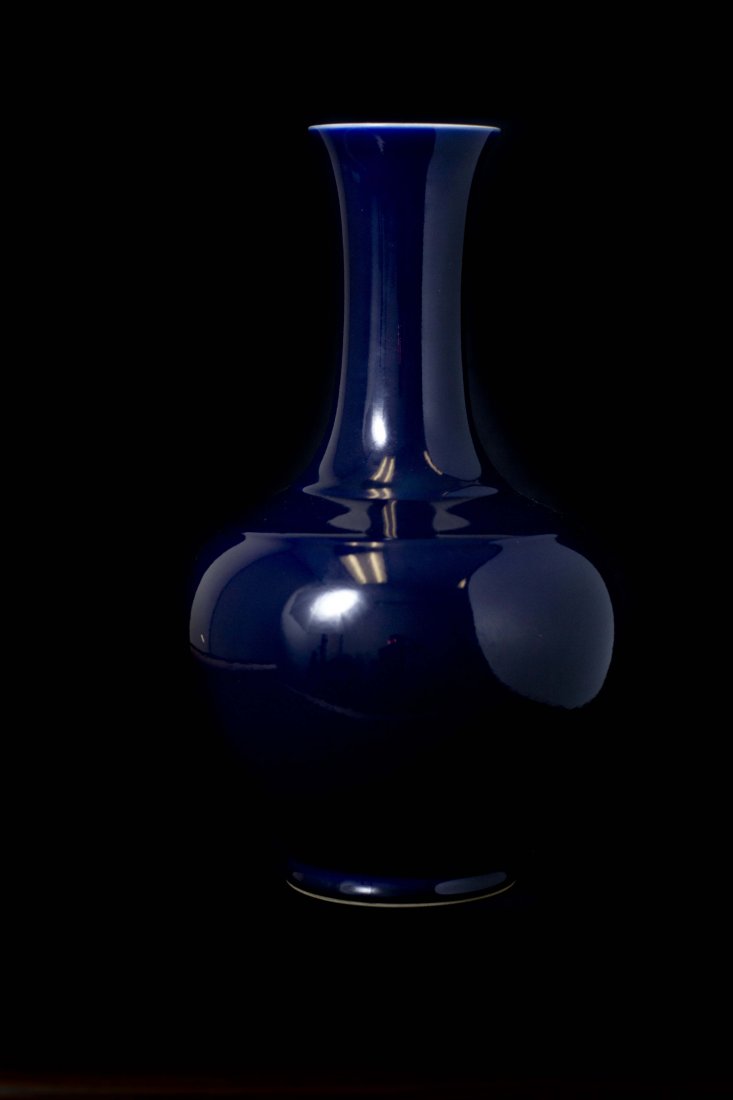 A blue glazed long neck vase: A rare blue glazed long neck vase, Chinese porcelain, 19th Century, Qianlong Mark on base. H 16.5in. (42cm)