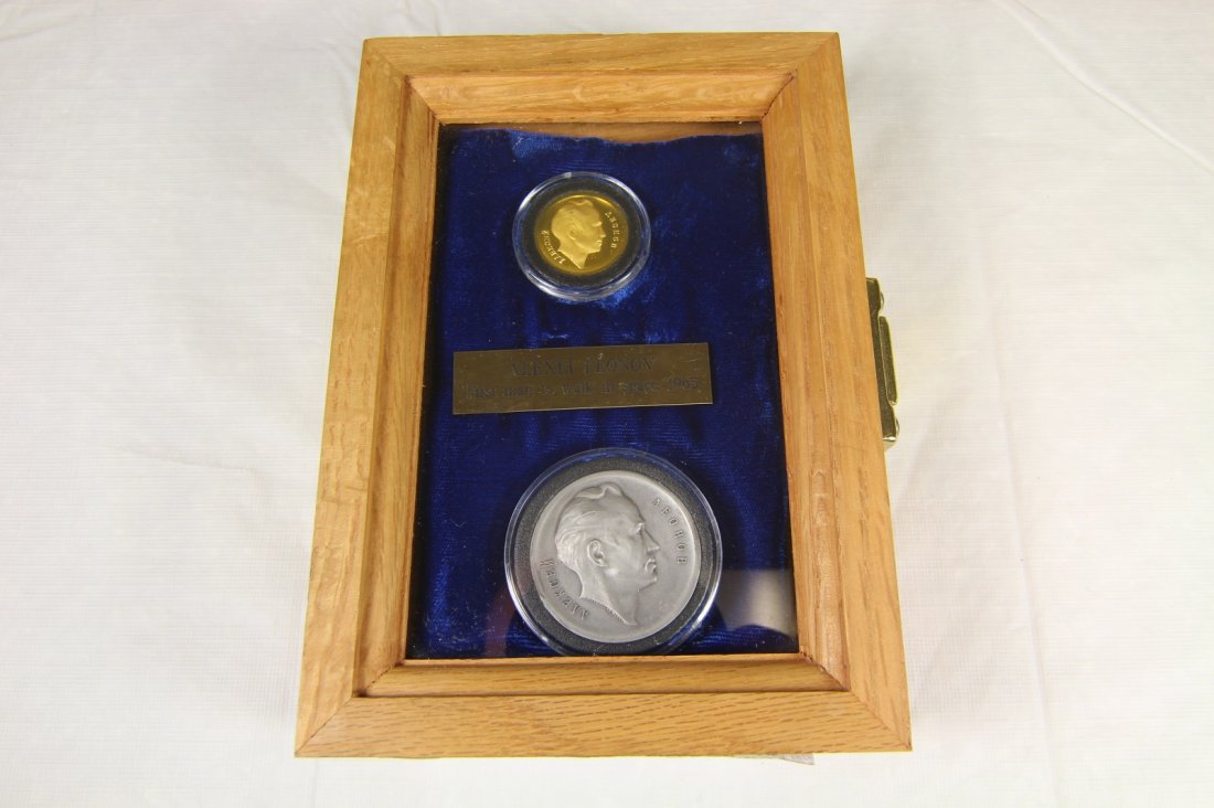 Russian Coin Set Alexei Leonov Gold & Silver w/ COA: 2 gold and silver medals commemorating the 1965 Voskhod-2 space mission and Alexei Leonov, the first man to walk in space. Both coins are made in a high relief proof like strikes; the gold having a mi