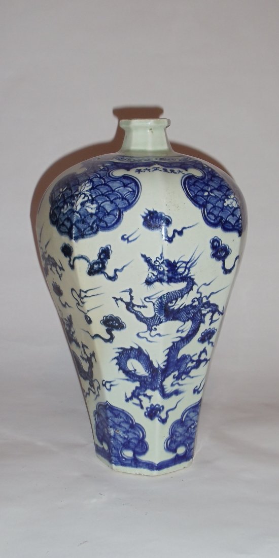 A Majestic Blue-White Hexagonal Meiping Vase with: The majestic meiping vase, Yuan Dynasty styled, is decorated with impressive motifs of lingzhi-heads and dragons chasing flaming balls amid clouds. It is hexagonally shaped, and representative of Chin