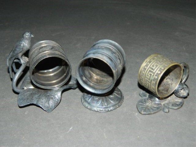 Meridian Silverplate Lot of 3 various Napkin Rings: Meridian Silverplate Lot of 3 various Napkin Rings Meridian Quadruple Plate. Various Designs. Tallest with bird 3" T. 2 of the 3 are Monogrammed.
