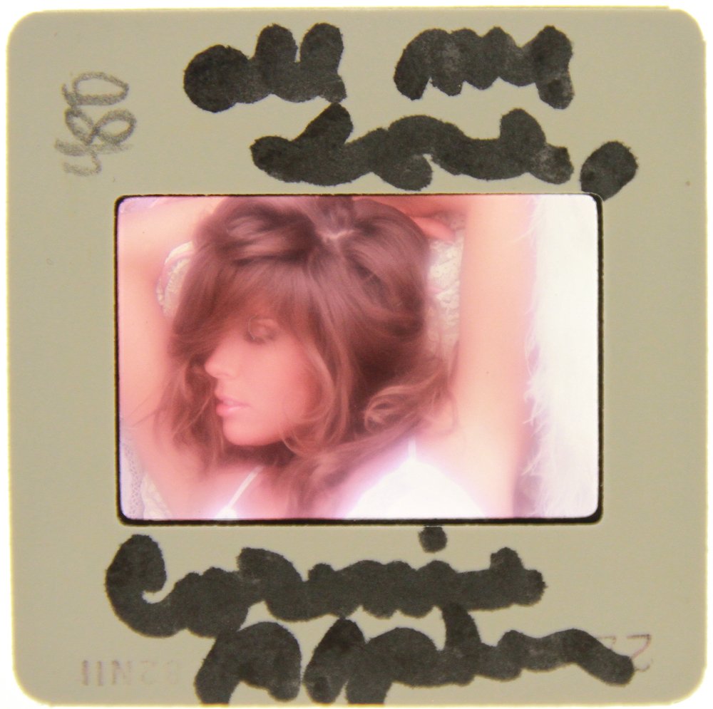 Original Signed Corinne Alphen 35mm '82 By Bob Guccione: Original nude, erotic, 35mm slide features Corinne Alphen taken by Bob Guccione in 1981. This slide was signed by the model herself during a visit to the Filthy Gorgeous Media studios.