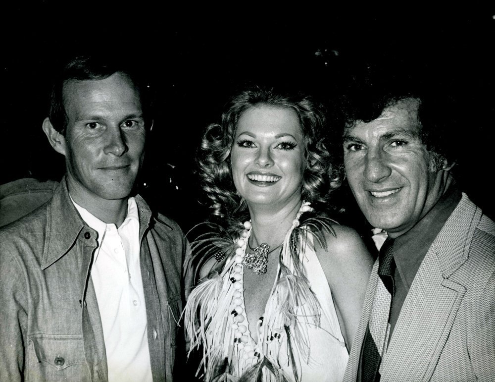 Tommy Smothers w/ Patricia Barrett 1973 B&W 10x8 Photo: This is an original black and white photo of Penthouse Pet Patricia "Cherokee" Barett with comedian Tommy Smothers taken by Peter C. Borsari ca 1973.