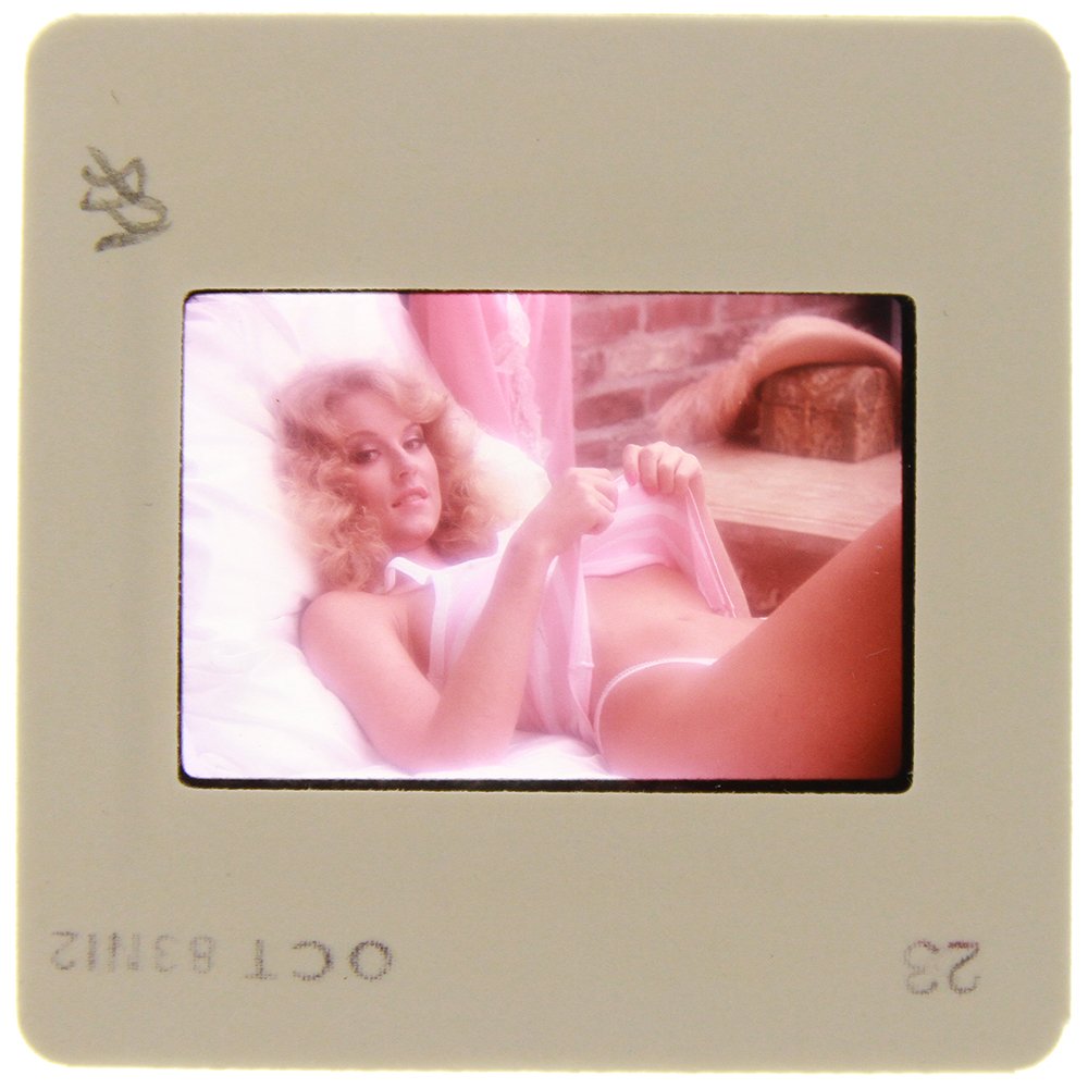Original 35mm Delia Impey 1985 By Bob Guccione: Original nude, erotic, 35mm slide features Delia Impey taken by Bob Guccione in 1985. Print and/or markings on the slide mount are original.