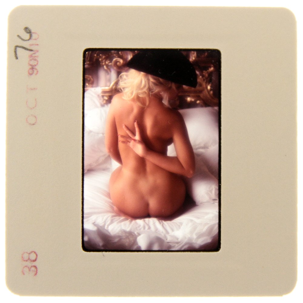 Original 35mm Simone Brigitte 1991 By Bob Guccione: Original nude, erotic, 35mm slide features Simone Brigitte taken by Bob Guccione in 1991. Print and/or markings on the slide mount are original.