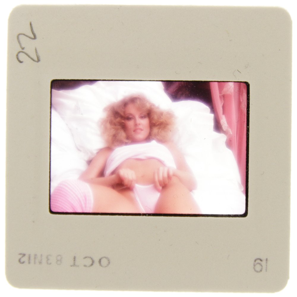 Original 35mm Delia Impey 1985 By Bob Guccione: Original nude, erotic, 35mm slide features Delia Impey taken by Bob Guccione in 1985. Print and/or markings on the slide mount are original.