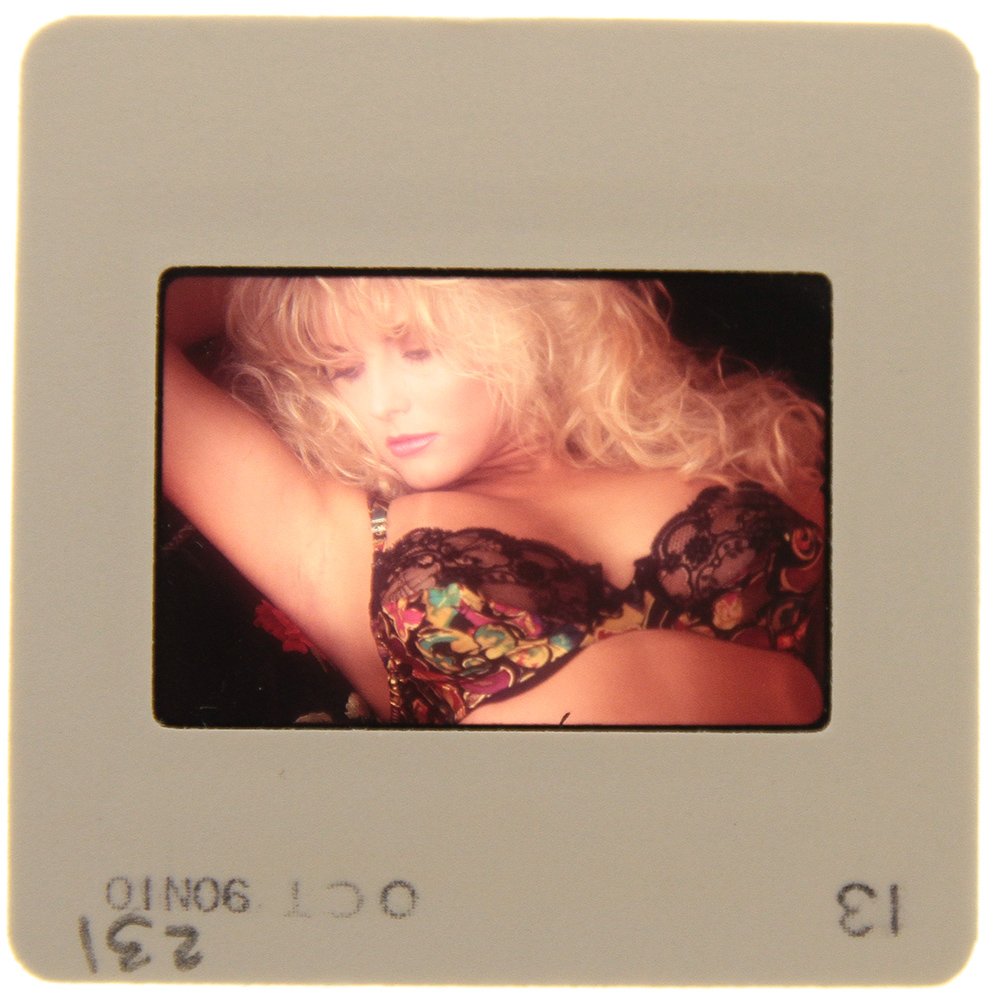 Original 35mm Simone Brigitte 1991 By Bob Guccione: Original nude, erotic, 35mm slide features Simone Brigitte taken by Bob Guccione in 1991. Print and/or markings on the slide mount are original.