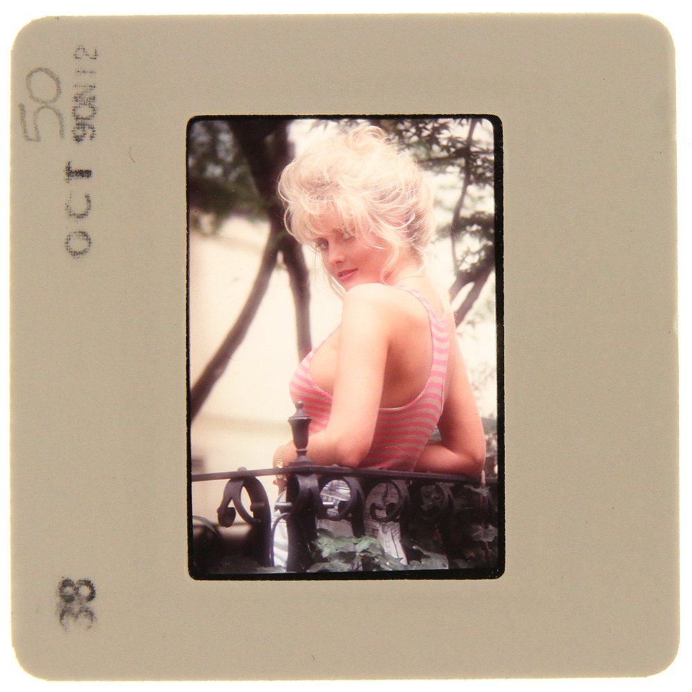 Original 35mm Simone Brigitte 1991 By Bob Guccione: Original nude, erotic, 35mm slide features Simone Brigitte taken by Bob Guccione in 1991. Print and/or markings on the slide mount are original.
