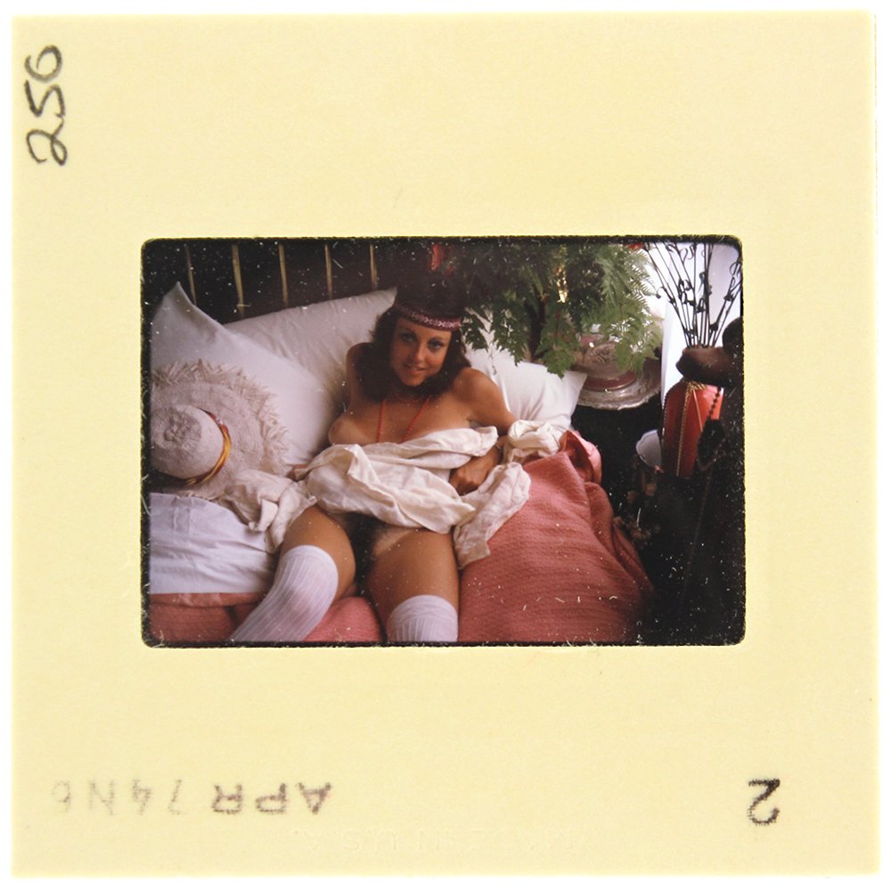 Lavinia Douglas 1974 35mm By Bob Guccione: Original 35mm slide features Lavinia Douglas taken by Bob Guccione in 1974. Print and/or markings on the slide mount are original.