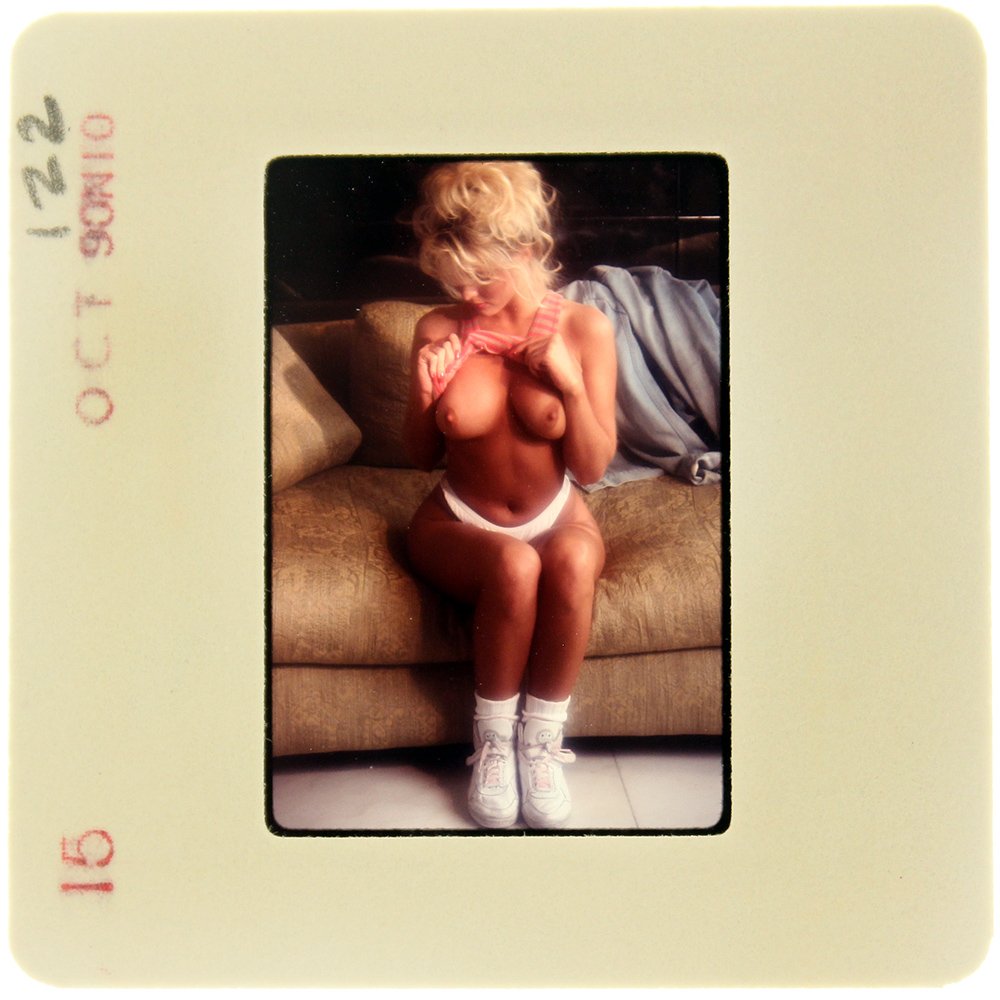 Simone Brigitte 1990 35mm By Bob Guccione: Original 35mm slide features Simone Brigitte taken by Bob Guccione in 1990. Print and/or markings on the slide mount are original.