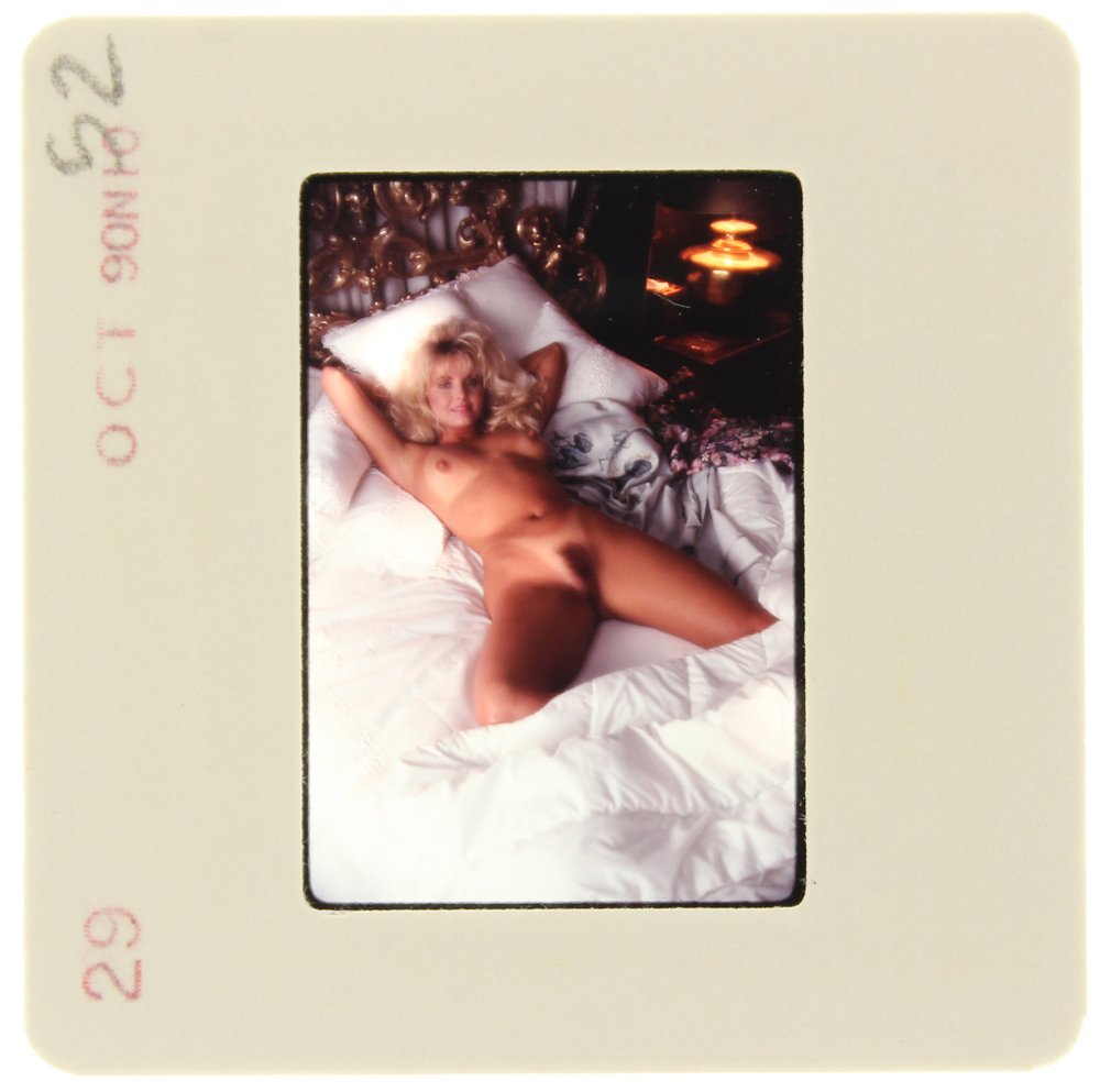 Simone Brigitte 1991 35mm By Bob Guccione: Original 35mm slide features Simone Brigitte taken by Bob Guccione in 1991. Print and/or markings on the slide mount are original.