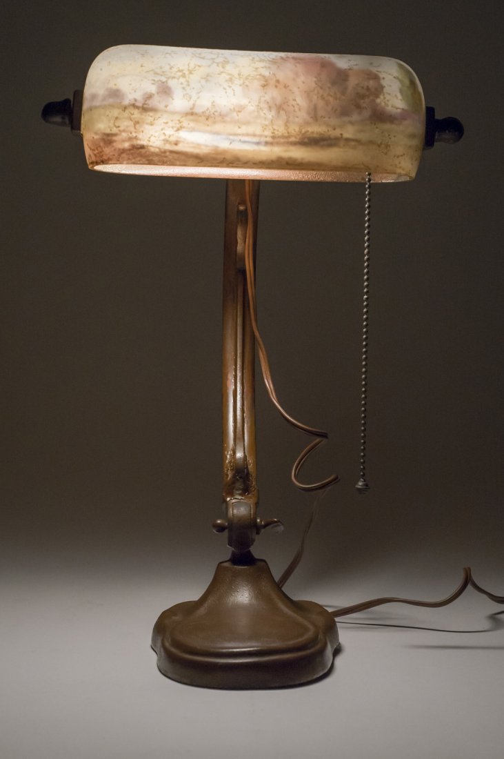 Handel Piano Lamp: The base here appears to have been painted brown at some point. The shade has a moderate chip. Both the base and shade are marked in the standard places for Handel piano lamps. 8 inch width, 13 1/2 in
