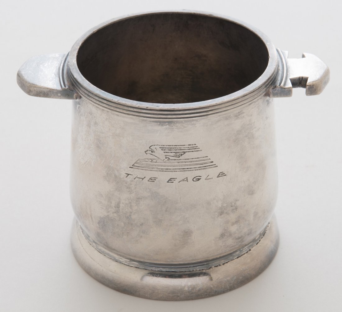 MP, T&P Dining Car Silver Serving Pieces (2): Two silver plated serving pieces top marked with "The Eagle" logo from the Missouri Pacific and Texas & Pacific Railroads. The first piece is a vessel with notched handle and is marked "International 