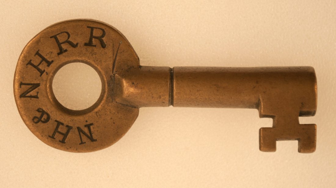 NH&NH Railroad Key: Brass switch key with serif letters marked NH&NHRR with single ring on barrel. We couldn't identify this but possibly a early part of the New Haven or maybe a New Hampshire railroad, also could be rel