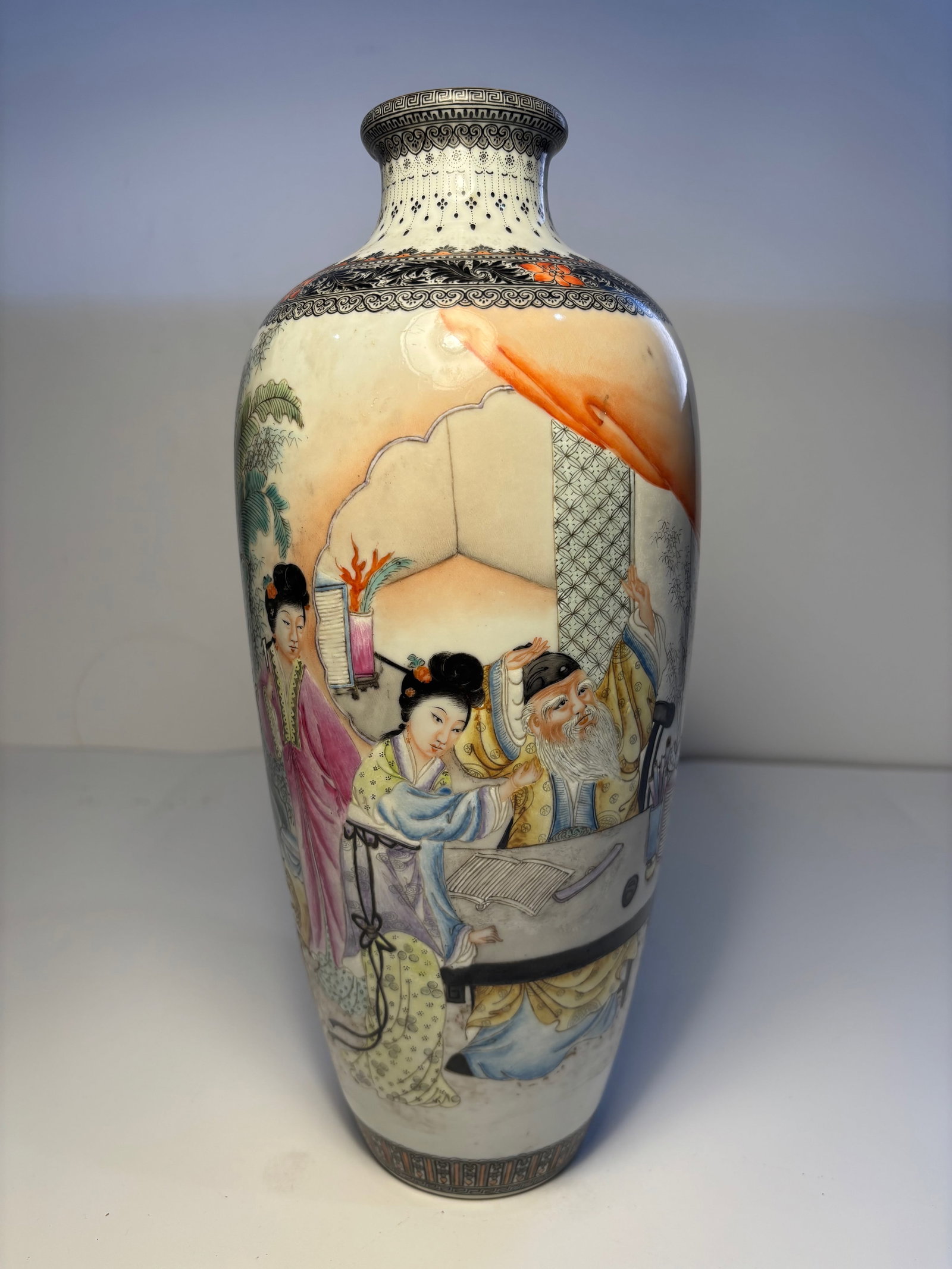 A Chinese famille rose porcelain vase with 'QianLong' Mark: Late 19th century , Beautiful shape vibrant and delicate colours. The intricate scene of figures engaged in daily or scholarly activities. Height:12.5 inches