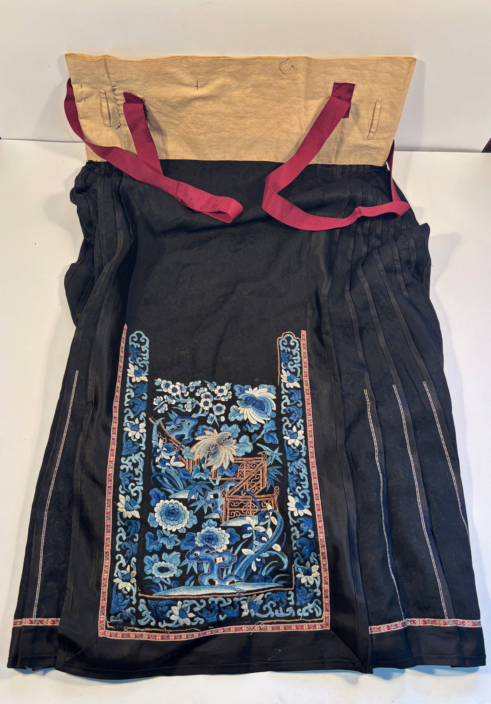 A Chinese embroidery pleated design skirt: 19TH CENTURY Length: 36 inches