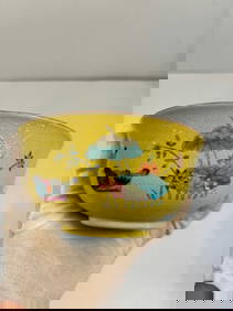 A Chinese famille rose yellow ground porcelain bowl with "QIANLONG" iron red mark (1 of 8)