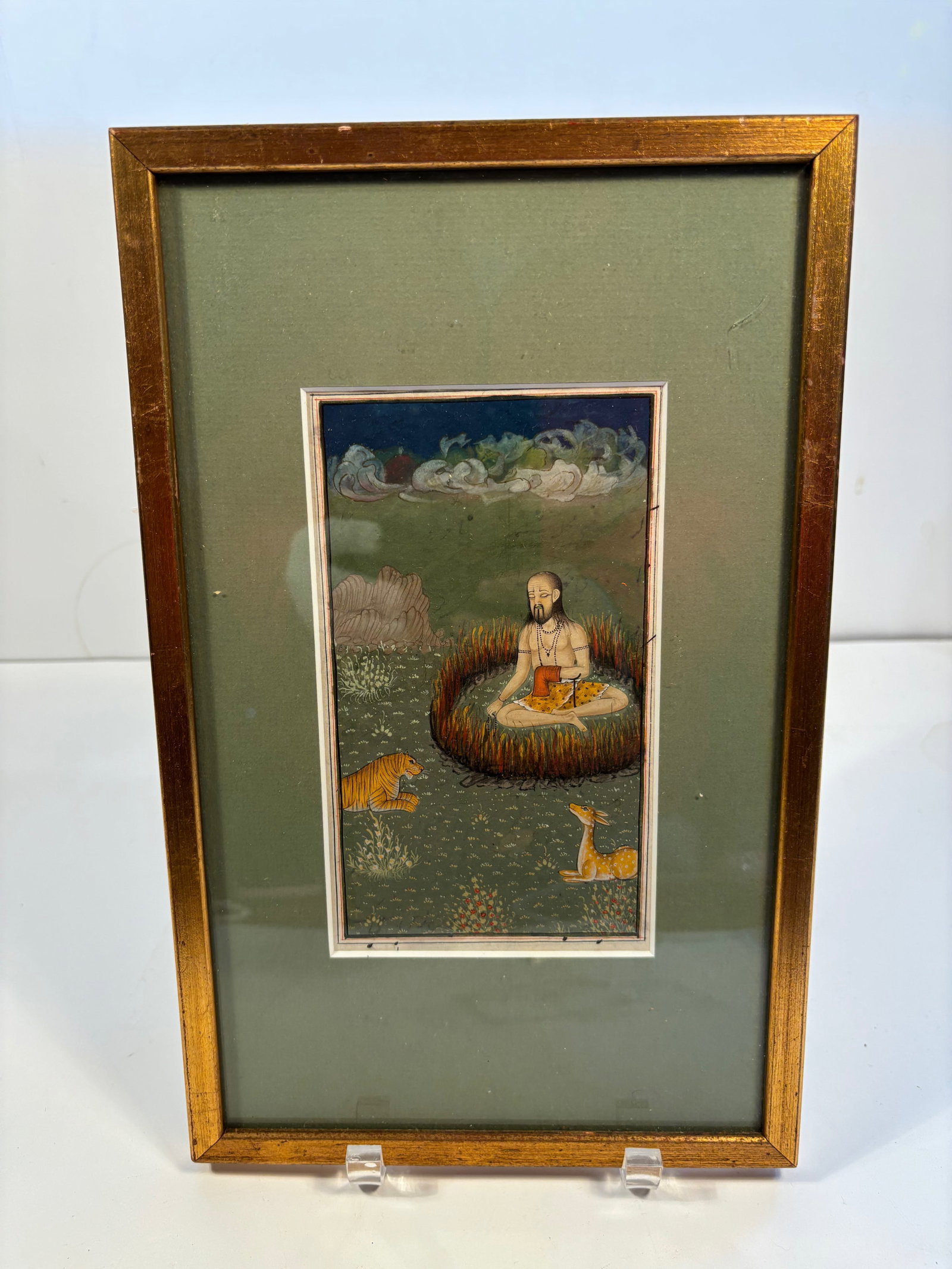 An indian miniature painting: 18th -19th century, a Hindu ascetic (sadhu or yogi) seated in a ring of fire, deep in meditation. Frame: 13 inches x 8.25 inches.