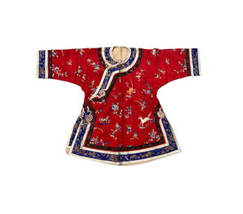 A Chinese silk embroidered woman’s jacket: Qing dynasty(1644-1912); A striking red silk woman’s jacket featuring finely executed embroidery in silk floss and metallic threads. The robe is elaborately decorated with auspicious motifs includin