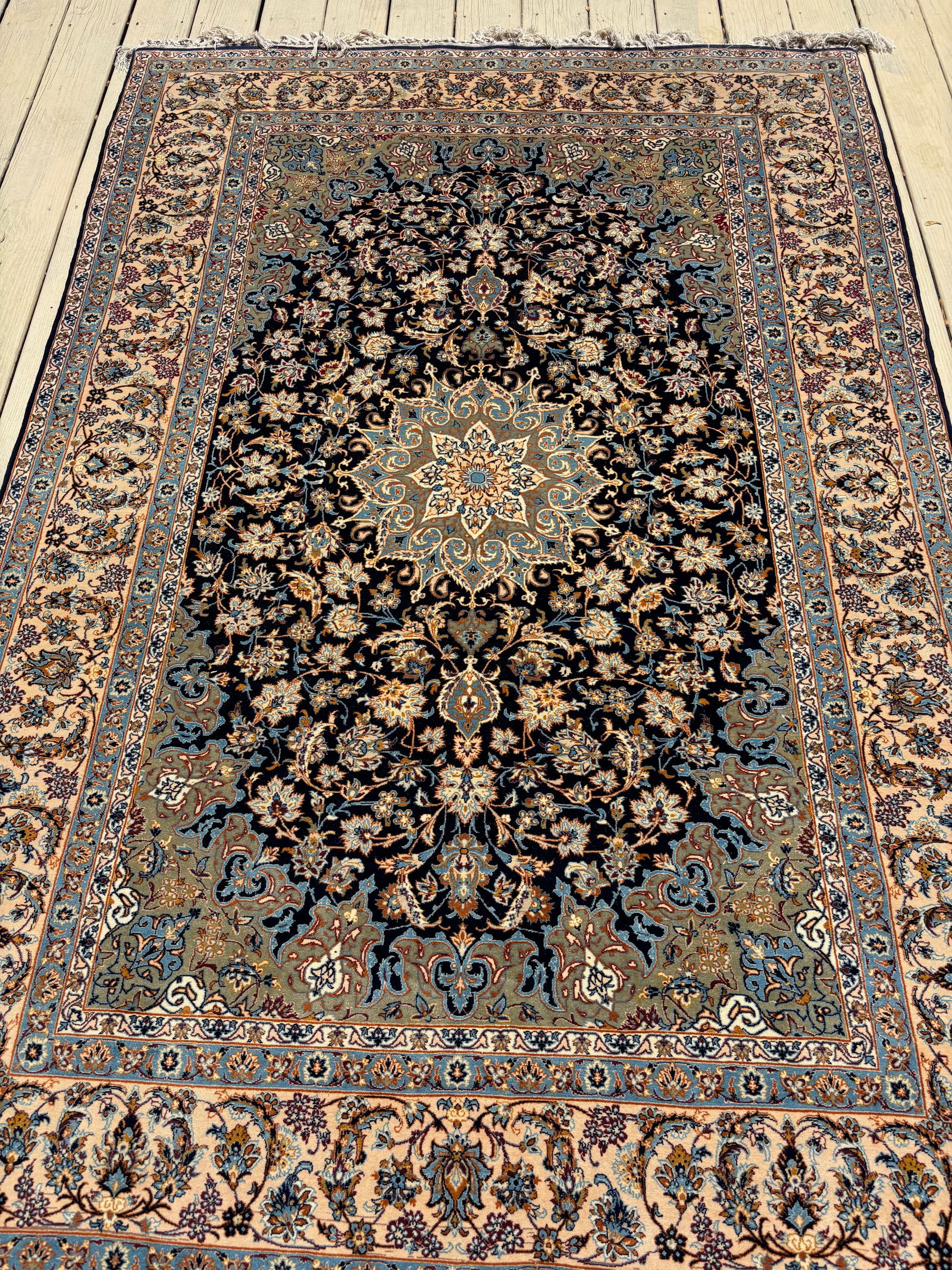 A Fine Hand-Knotted Persian Nain/Isfahan Rug 100% silk: Probably 20th century, An exquisite example of Persian silk weaving, this luxurious Nain rug is entirely hand-knotted in pure silk on a silk foundation. The deep navy field is richly decorated with a