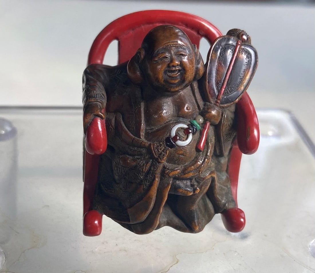 A boxwood and lacquer netsuke of Hotei as a Zen monk, by Chikusai. (1 of 11)