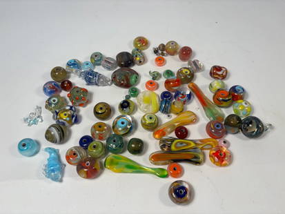 Large Lot of Colorful Artisan Lampwork Glass Beads – Swirl, Millefiori, Eye, Mixed Shapes: A vibrant assortment of approximately 70 handmade lampwork glass beads in a variety of sizes, shapes, and colors. This lot includes both round and sculptural forms with eye-catching designs such as sw