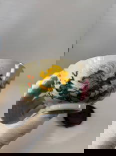 A Chinese Famille Rose Porcelain  Bowl with Red Seal Mark: 19th century; A finely enamelled Chinese porcelain tea bowl, decorated in the famille rose palette with lush blooming peonies in pink, yellow, and green foliage on a white ground. The bowl rests on a