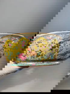 A Chinese Famille Rose Yellow-Ground Jardinière with Birds and Peonies: 19th century: Featuring a central scene of pheasants perched among blossoming peony branches. The rim is bordered with a ruyi scroll design and the interior is finished in turquoise glaze. The base be