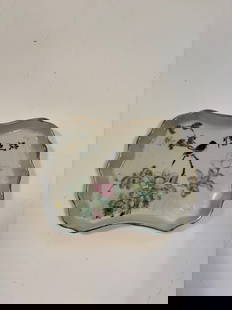 A Chinese famille rose porcelain ink-washer plate with Chinese Caligraphy: Late 19th to early 20th, features birds and flower motif. Length: 7 inches; Width: 5.25 inches;