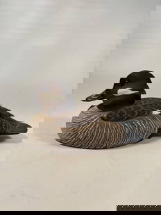 Hand-Carved Bufflehead Hen Duck  Decorative  Decoy signed and dated 1993: The decoy includes carved feather details, subtle painted textures, and a felt-covered base. Height: 4.5 inches Length: 9 inches ; Width: 5 inches.
