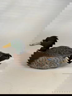 Hand-Carved Mallard Drake Decorative Decoy signed and dated 1992: Lifelike hand-carved wooden model of a Mallard drake, featuring a rich green head, yellow bill, and finely detailed featherwork in brown, gray, and blue. Signed and dated underneath.Retains the origin