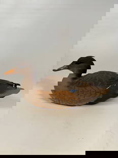 Hand-Carved Mallard Hen Decorative Decoy signed and dated 1992: Naturalistic hand-carved wooden model of a Mallard hen, featuring beautifully textured feather patterns in tan and brown, with subtle highlights and blue wing accents. Signed underneath. Felted base w